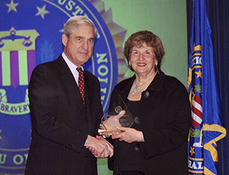 Former FBI Directot Muellr Roberer and Paula Goldberg