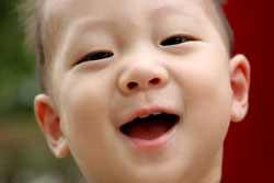 close up of a young boy smiling
