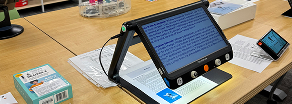 Reading devices for low vision assistance on a wood table